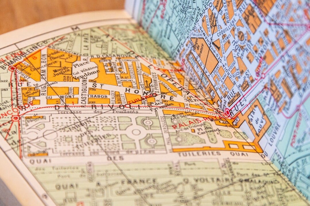 Magnifying glass resting on an old city map