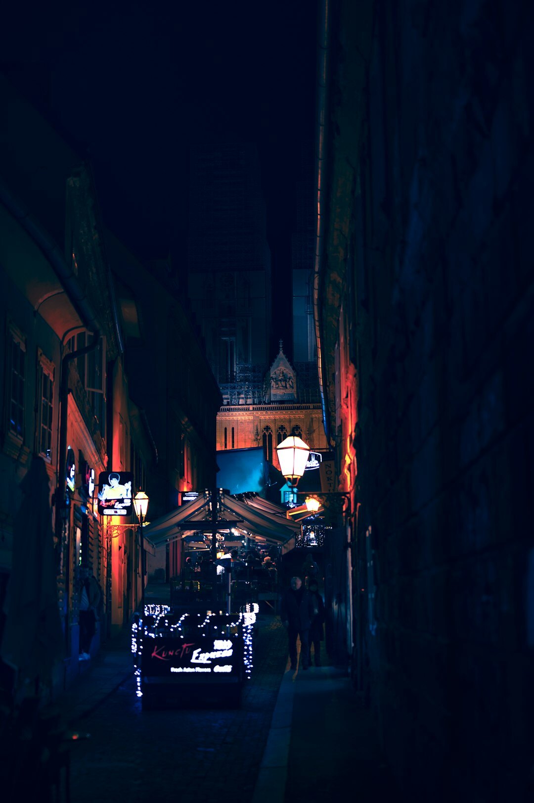 Foggy cobbled street in Zagreb's Upper Town at night with old street lamps