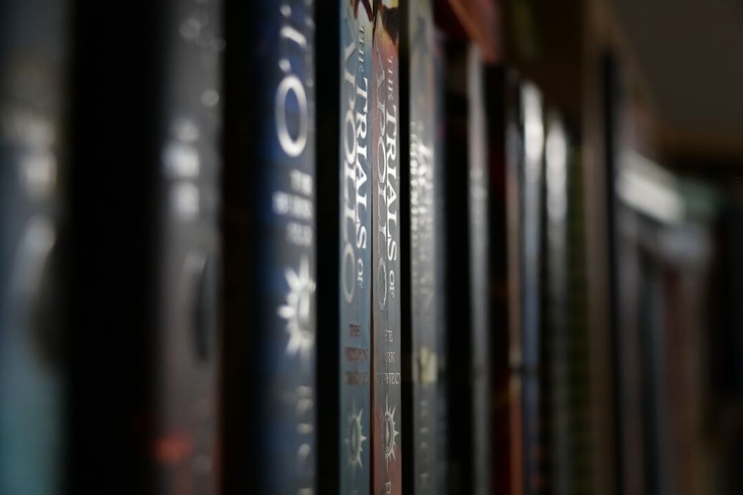 old books on wooden shelf
