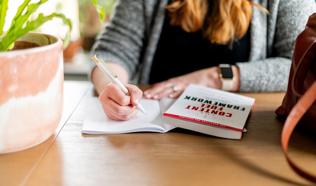writer at desk with notebook